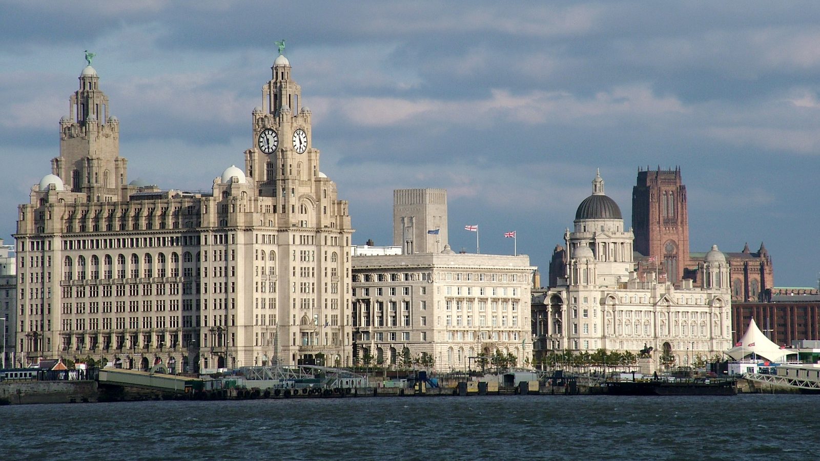 Pier Head buildings in Liverpool under a blue sky